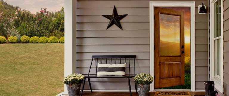 wood front door with sunset